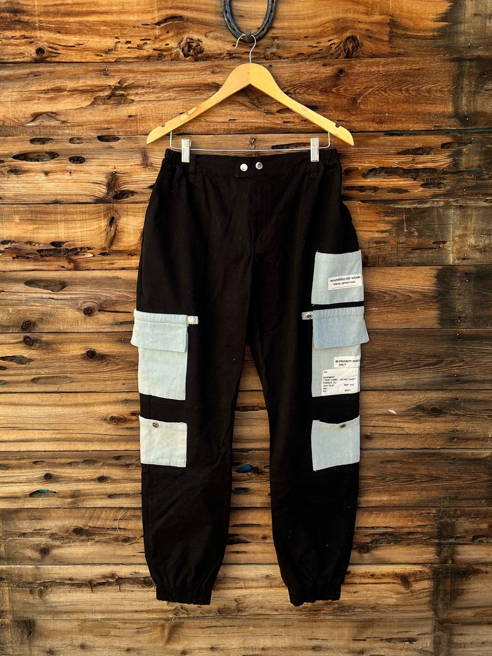 MANIERE DE VOIR | Black Cargo Pants with Light Blue Patch Pockets 16